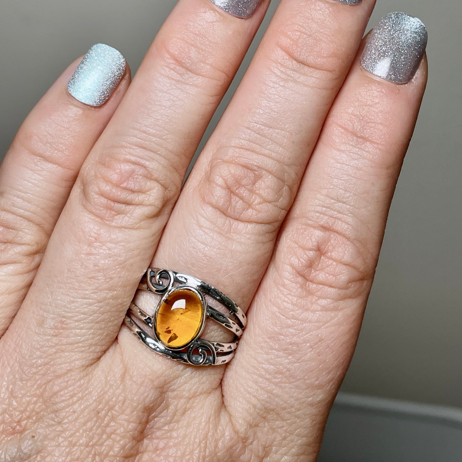 Amber Oval Cabochon Ring in a Decorative Setting R4025
