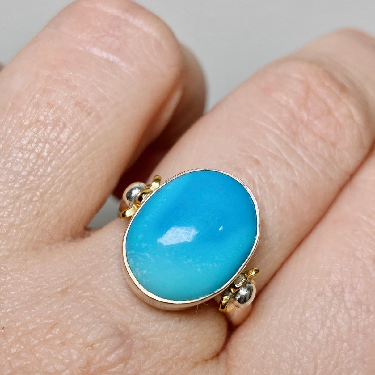 Arizona Turquoise Oval Cabochon Ring with Brass Accents Size 7 KRGJ3400