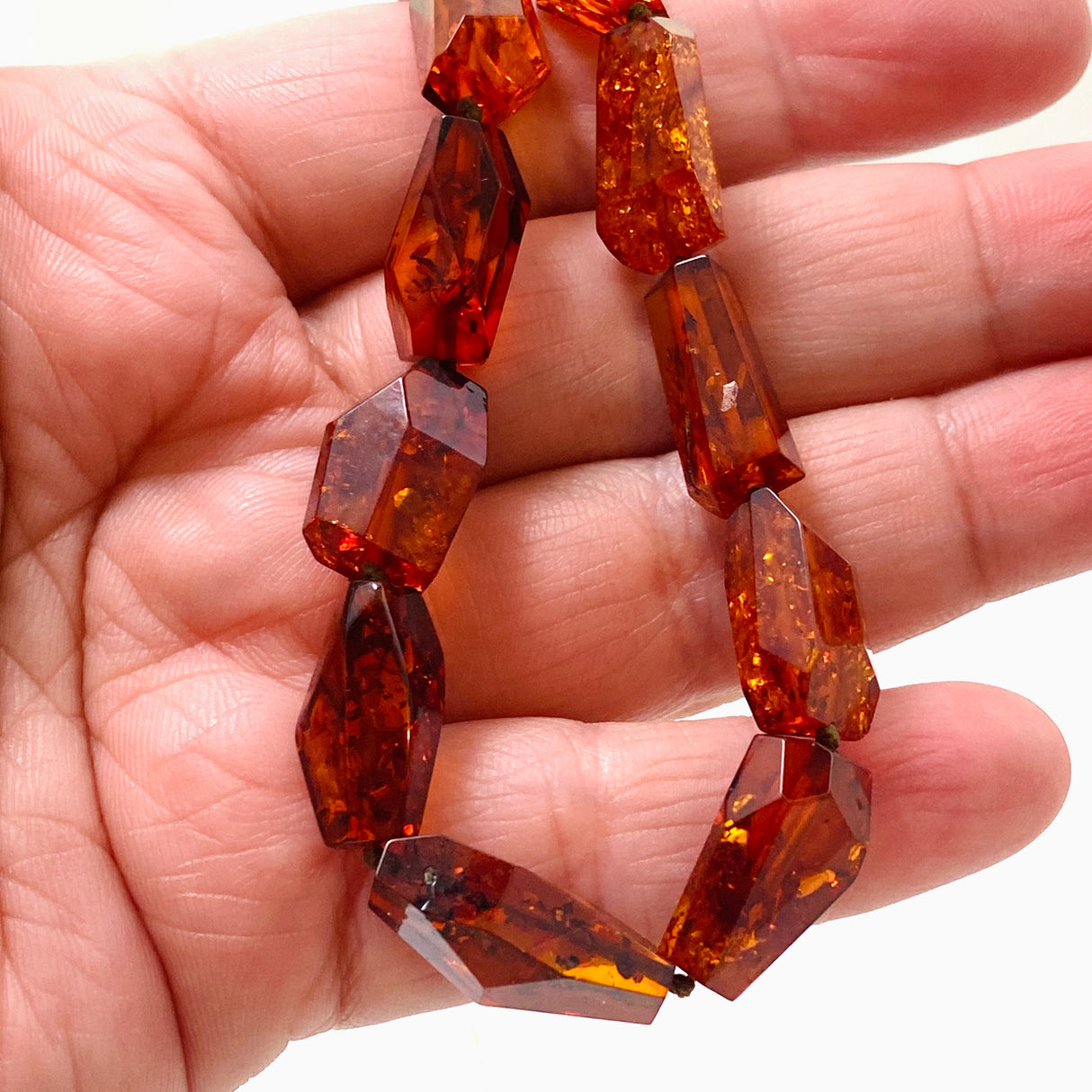 Baltic Amber Cognac beaded necklace on black leather AMB308