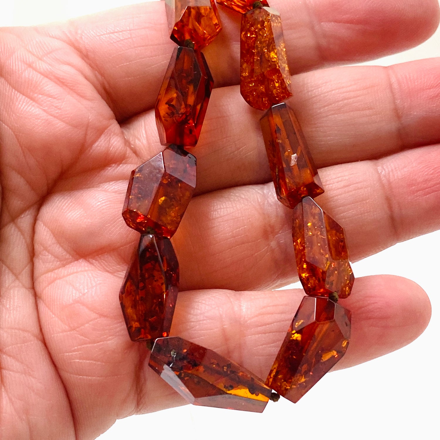 Baltic Amber Cognac beaded necklace on black leather AMB308