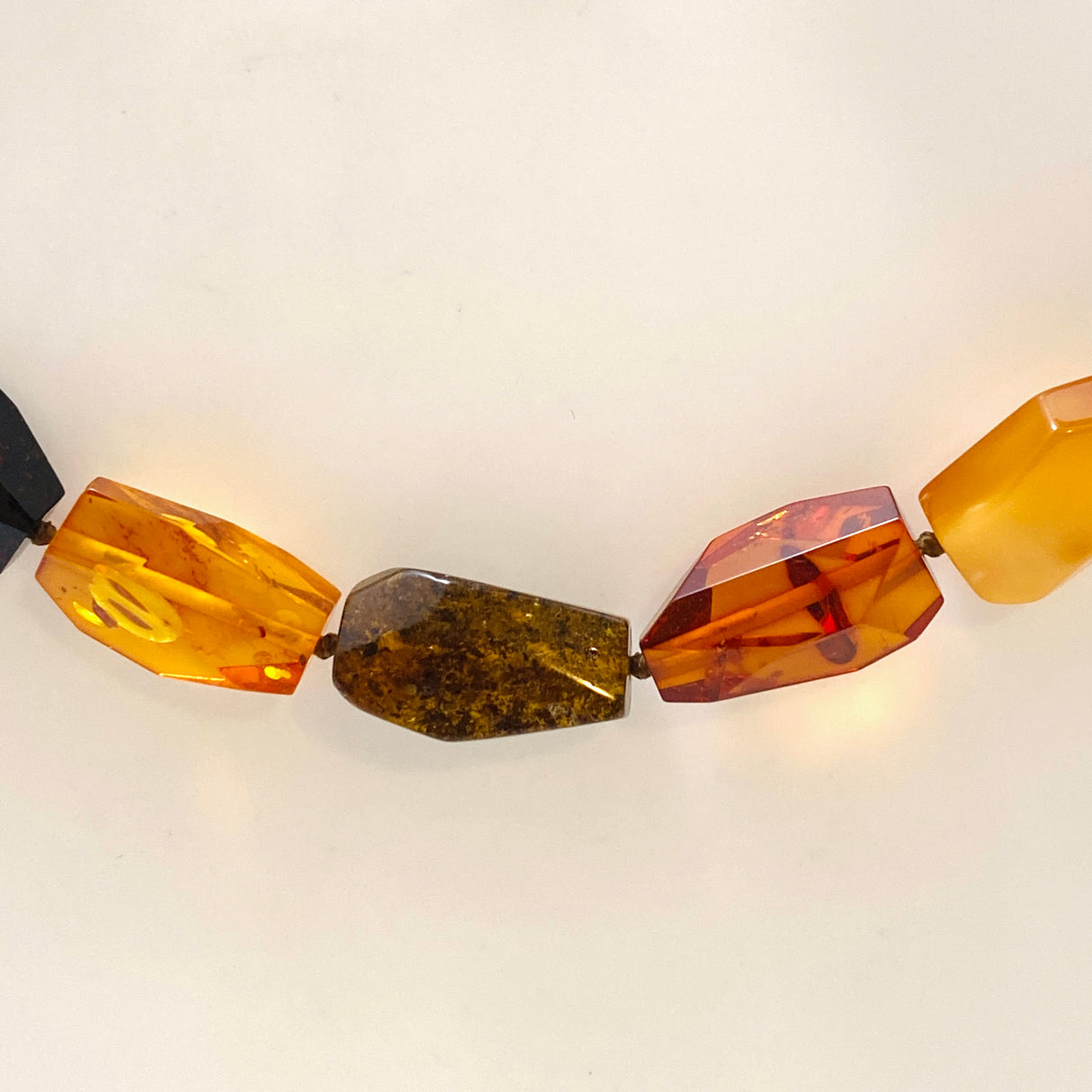 Baltic Amber Mixed beaded necklace on black leather AMB306