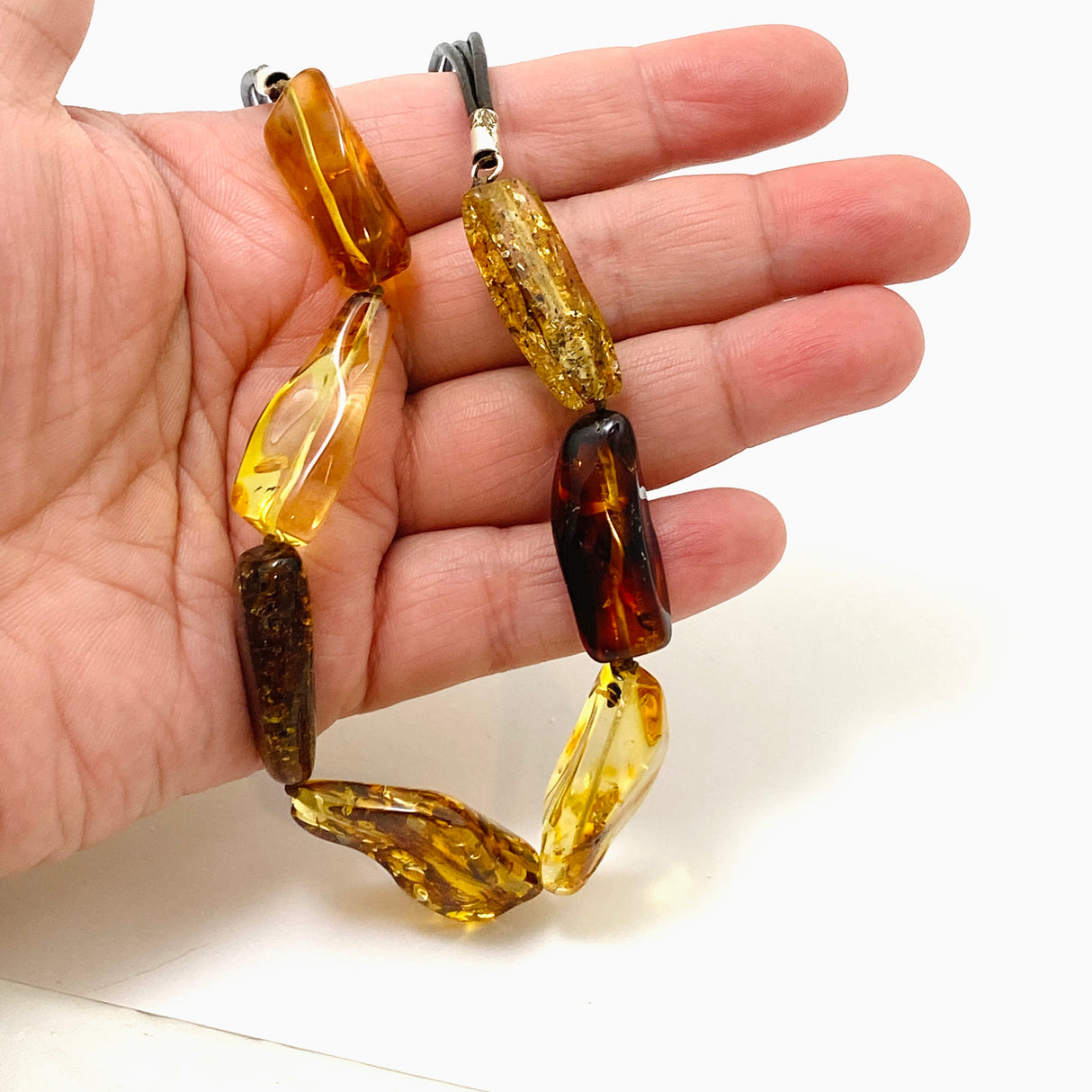 Baltic Amber Mixed beaded necklace on black leather AMB307