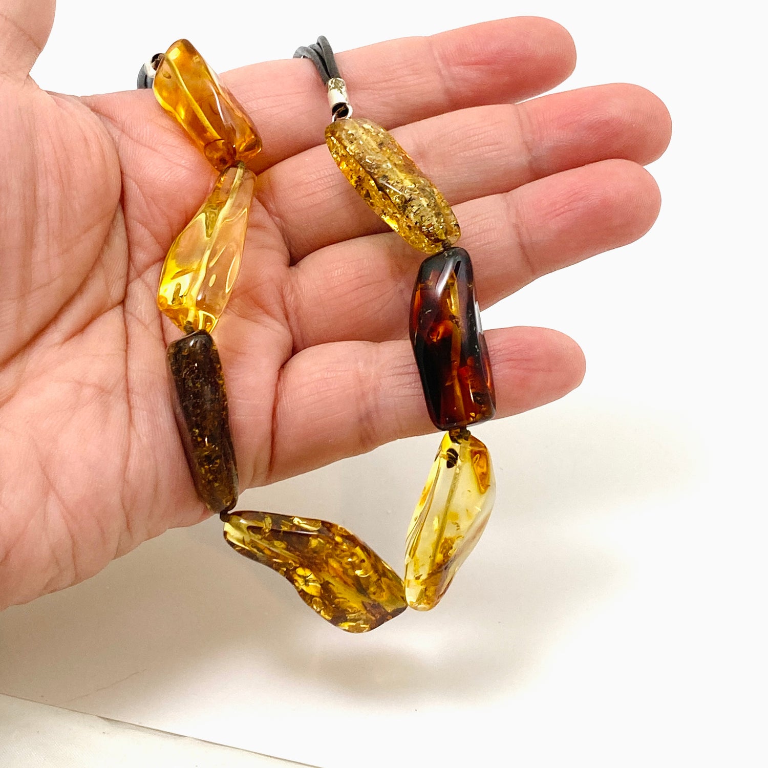 Baltic Amber Mixed beaded necklace on black leather AMB307