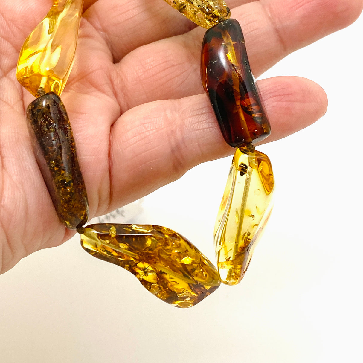 Baltic Amber Mixed beaded necklace on black leather AMB307