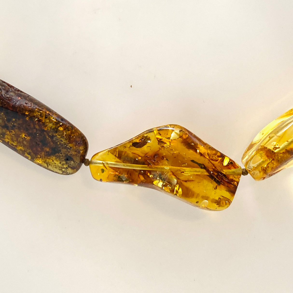 Baltic Amber Mixed beaded necklace on black leather AMB307