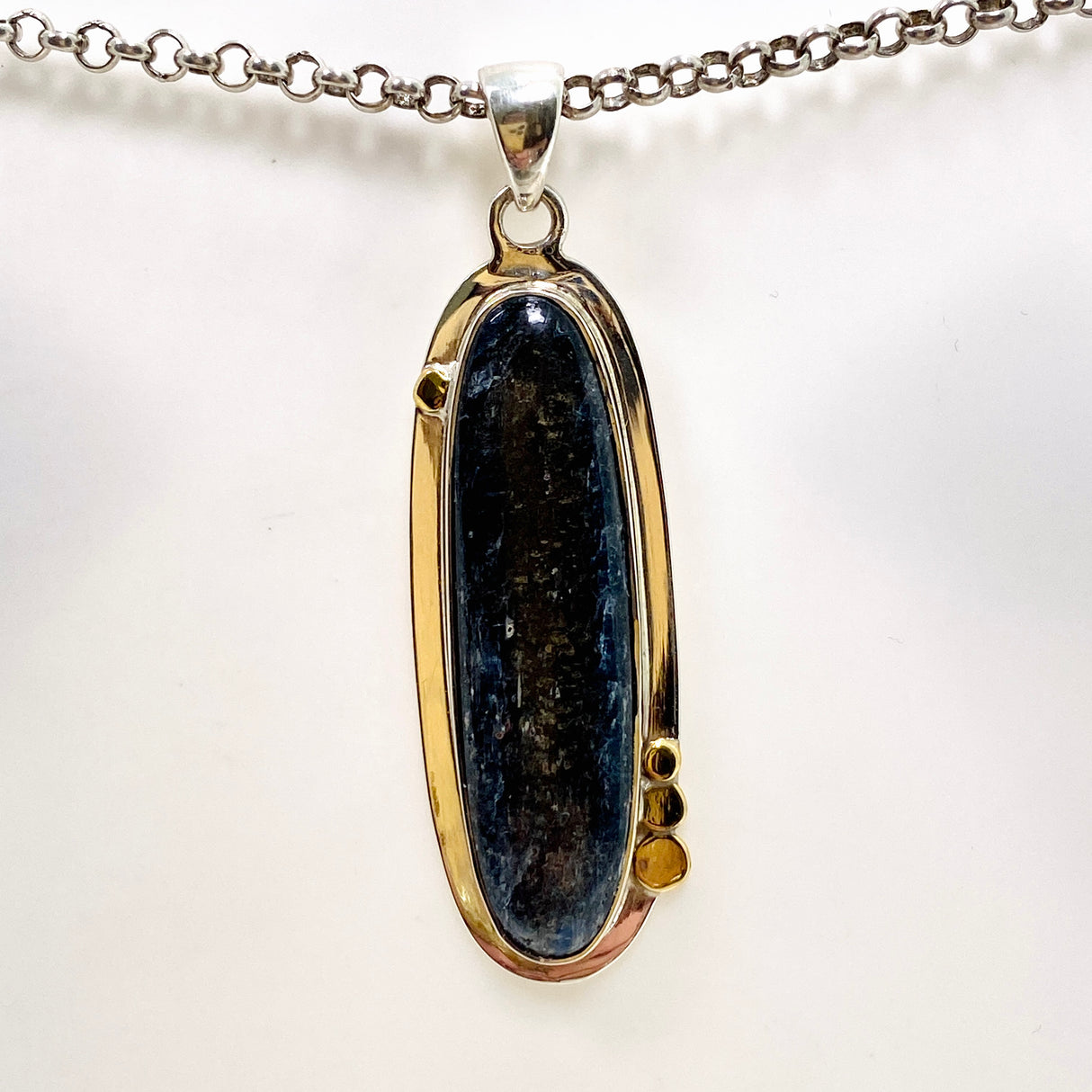 Blue Kyanite Oval Cabochon Pendant with Brass Detailing KPGJ4617