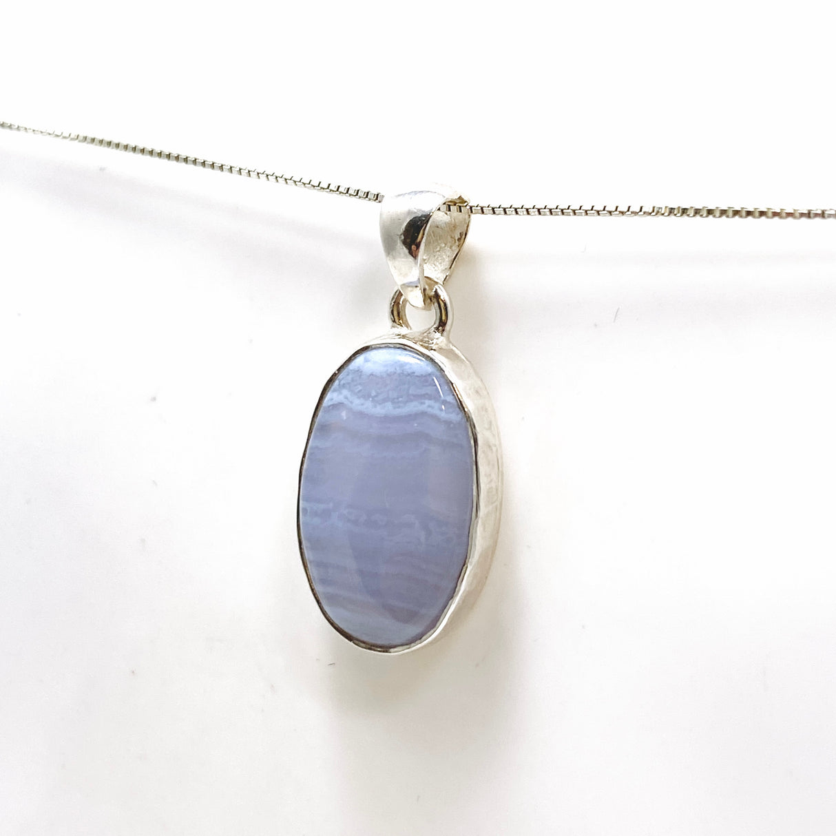 Blue Lace Agate Oval Cabochon Pendant in a Hammered Setting KPGJ4818