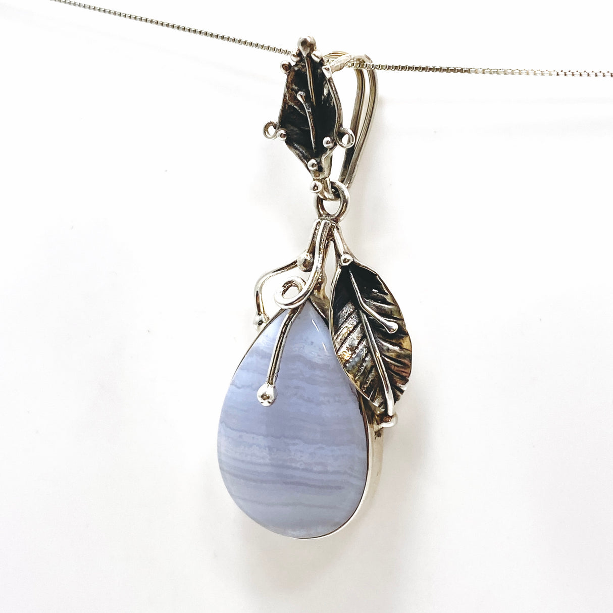 Blue Lace Agate Teardrop Cabochon Pendant in a Botanical Setting PPGJ989