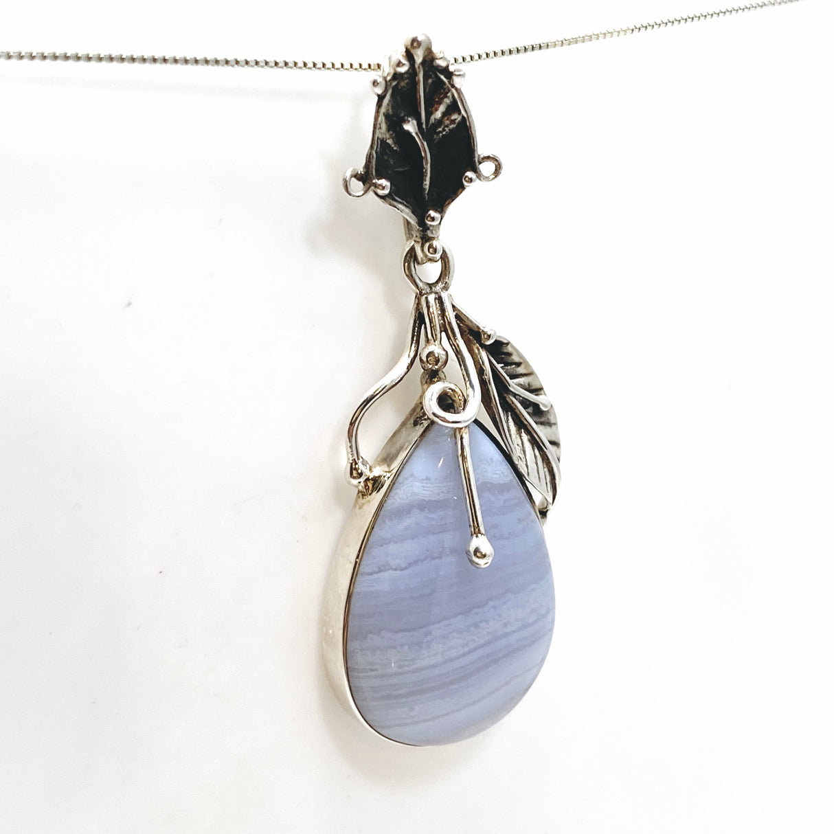 Blue Lace Agate Teardrop Cabochon Pendant in a Botanical Setting PPGJ989