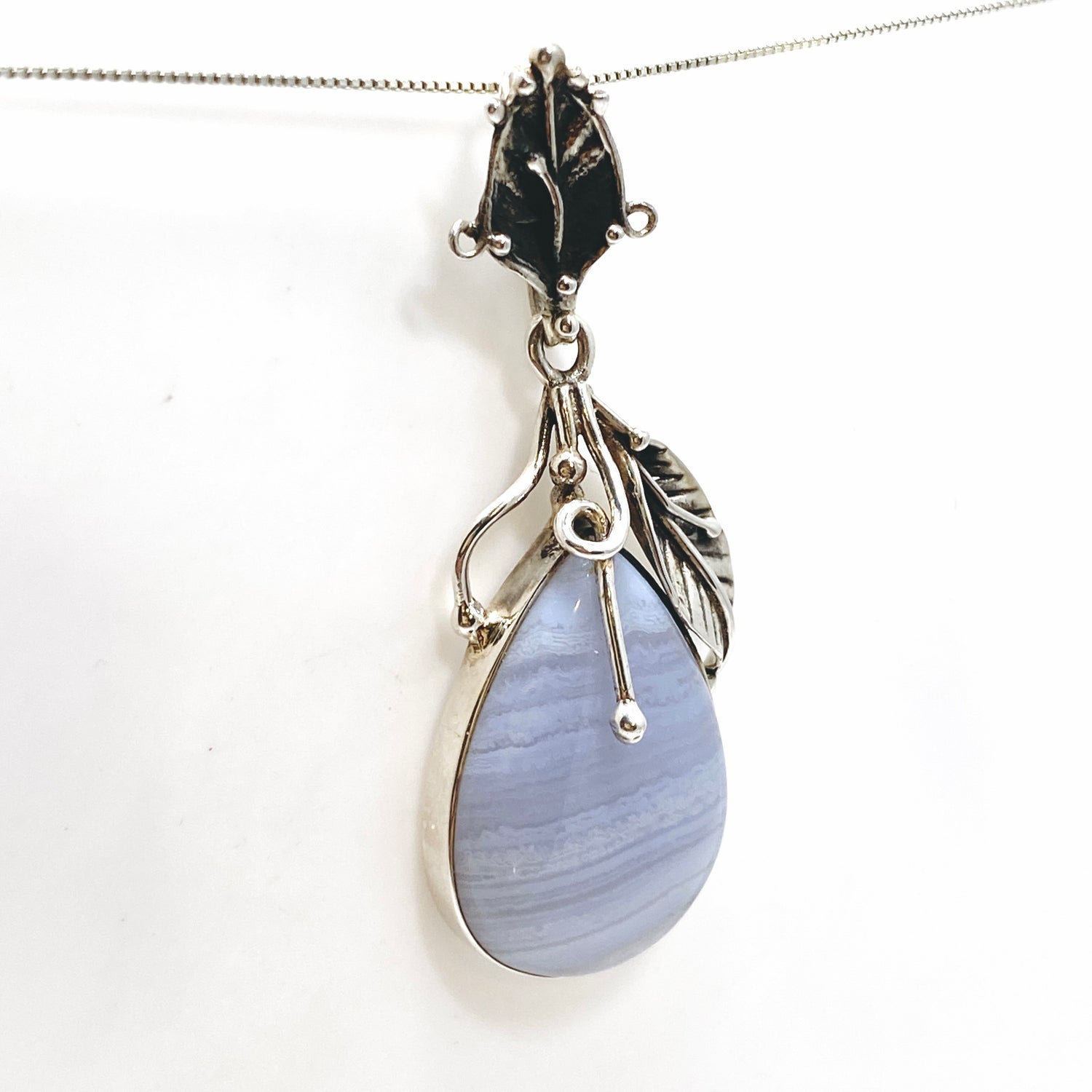 Blue Lace Agate Teardrop Cabochon Pendant in a Botanical Setting PPGJ989
