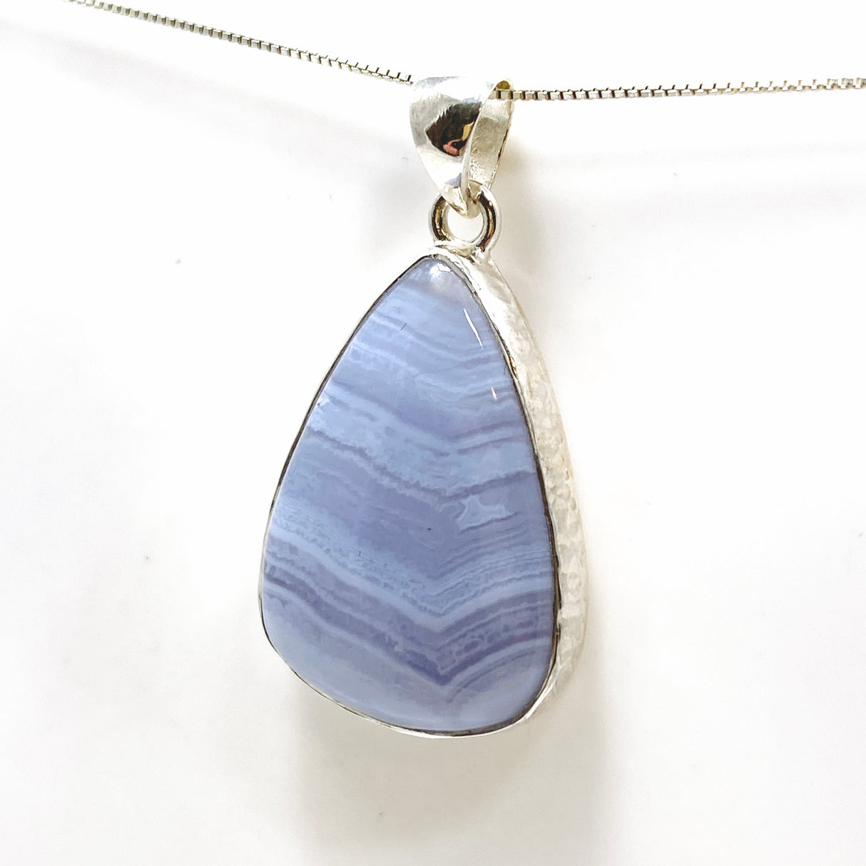 Blue Lace Agate Teardrop Cabochon Pendant in a Hammered Setting KPGJ4830