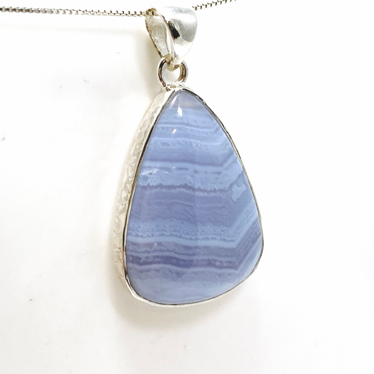 Blue Lace Agate Teardrop Cabochon Pendant in a Hammered Setting KPGJ4830