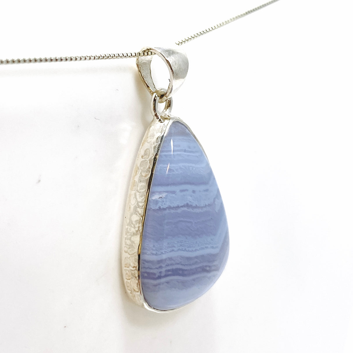 Blue Lace Agate Teardrop Cabochon Pendant in a Hammered Setting KPGJ4830