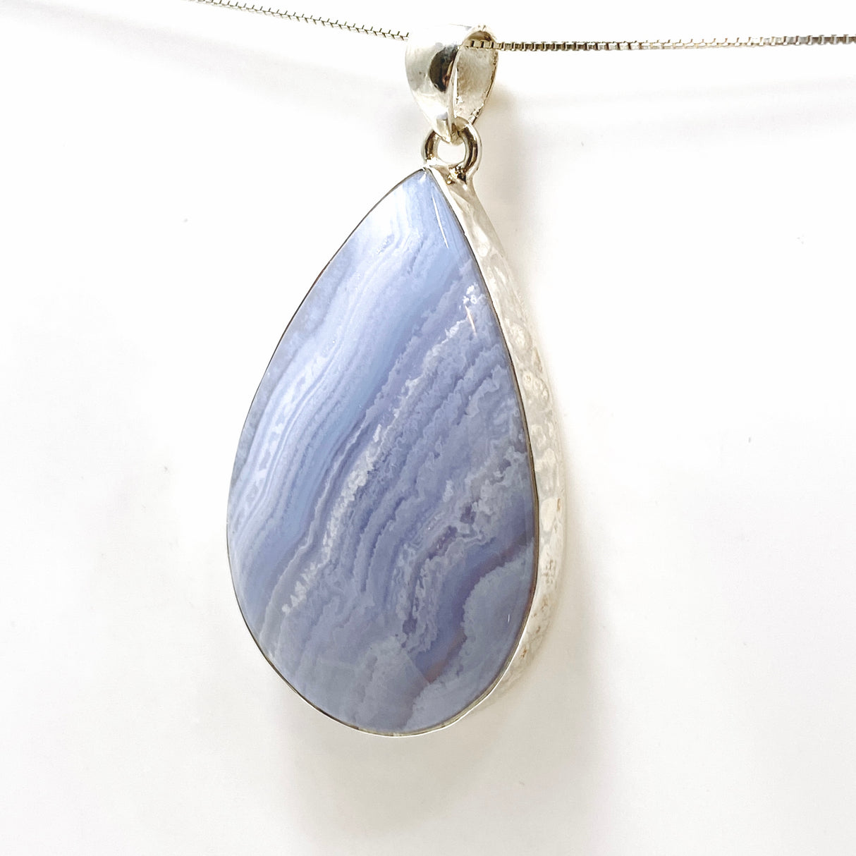 Blue Lace Agate Teardrop Cabochon Pendant in a Hammered Setting KPGJ4831