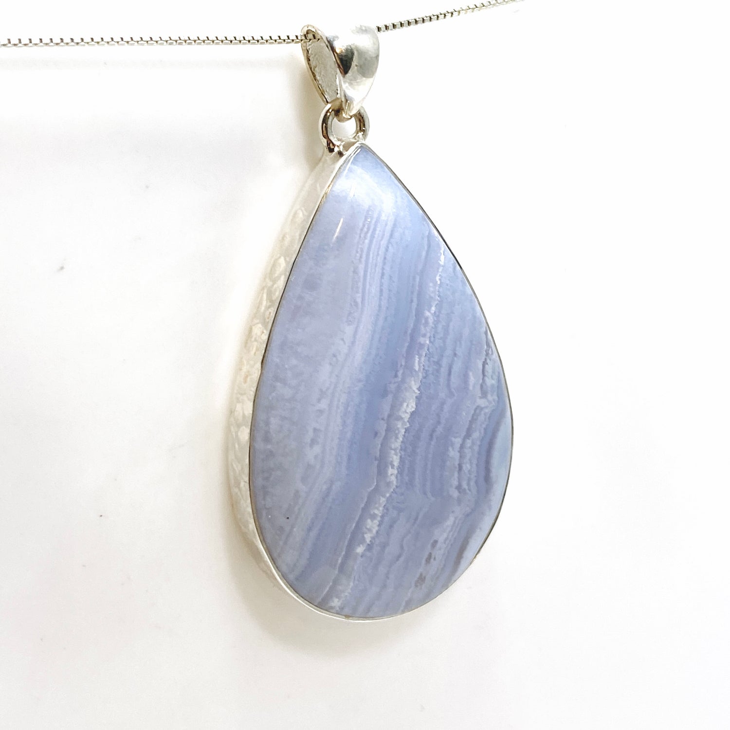 Blue Lace Agate Teardrop Cabochon Pendant in a Hammered Setting KPGJ4831