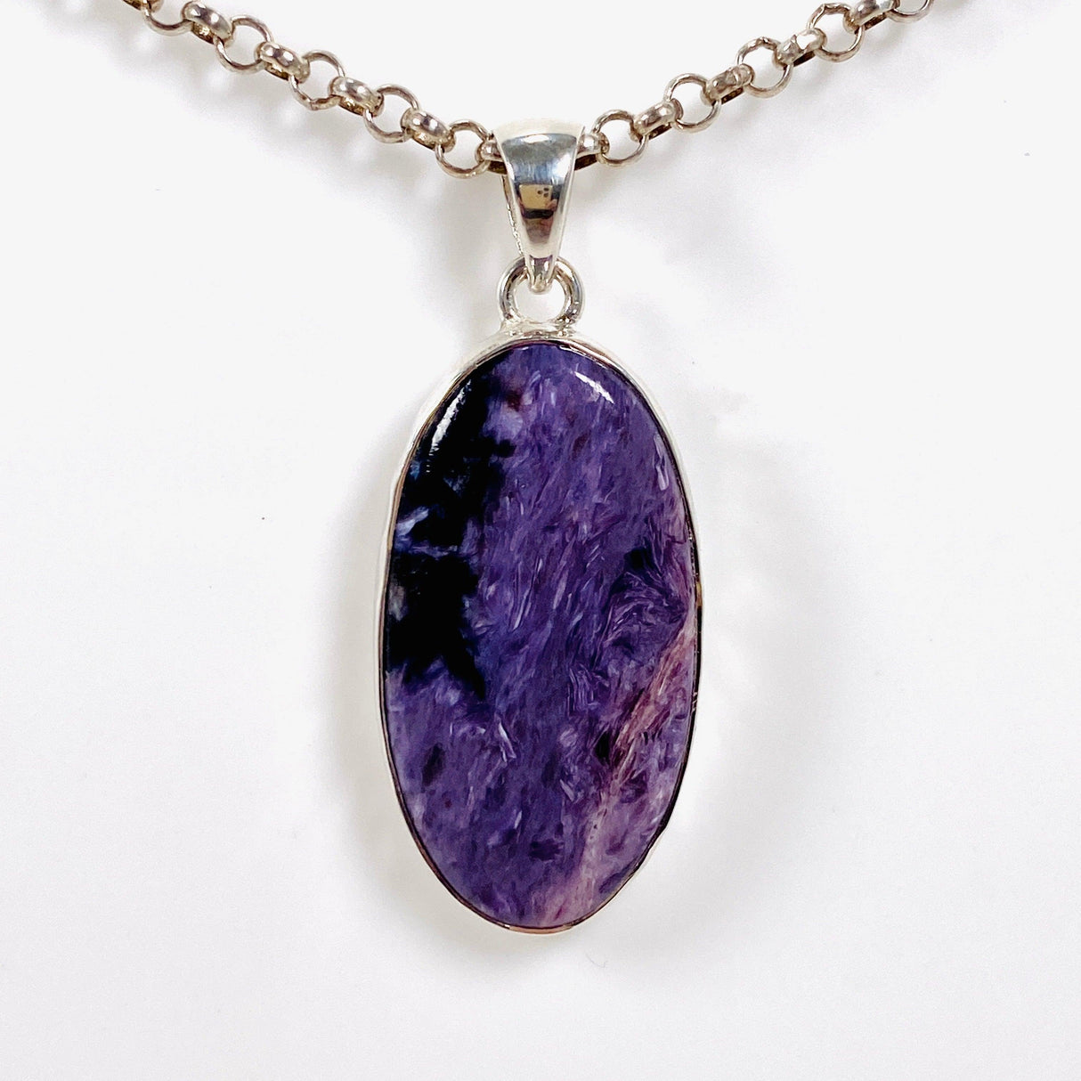 Purple Charoite oval pendant in sterling silver on a chain