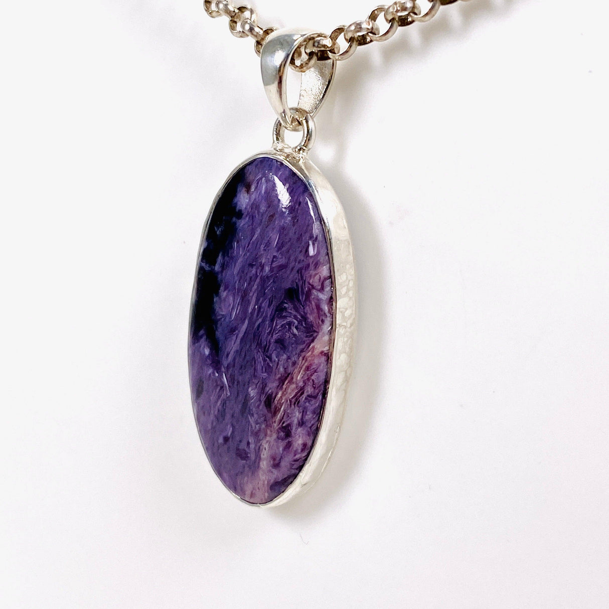 Purple Charoite oval pendant in sterling silver on a chain