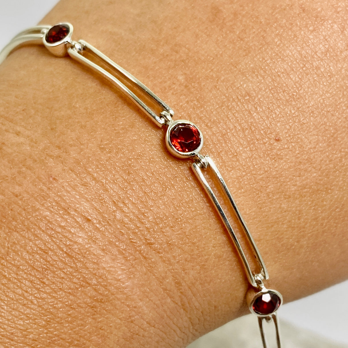 Garnet round faceted gemstones with silver split spacer design
