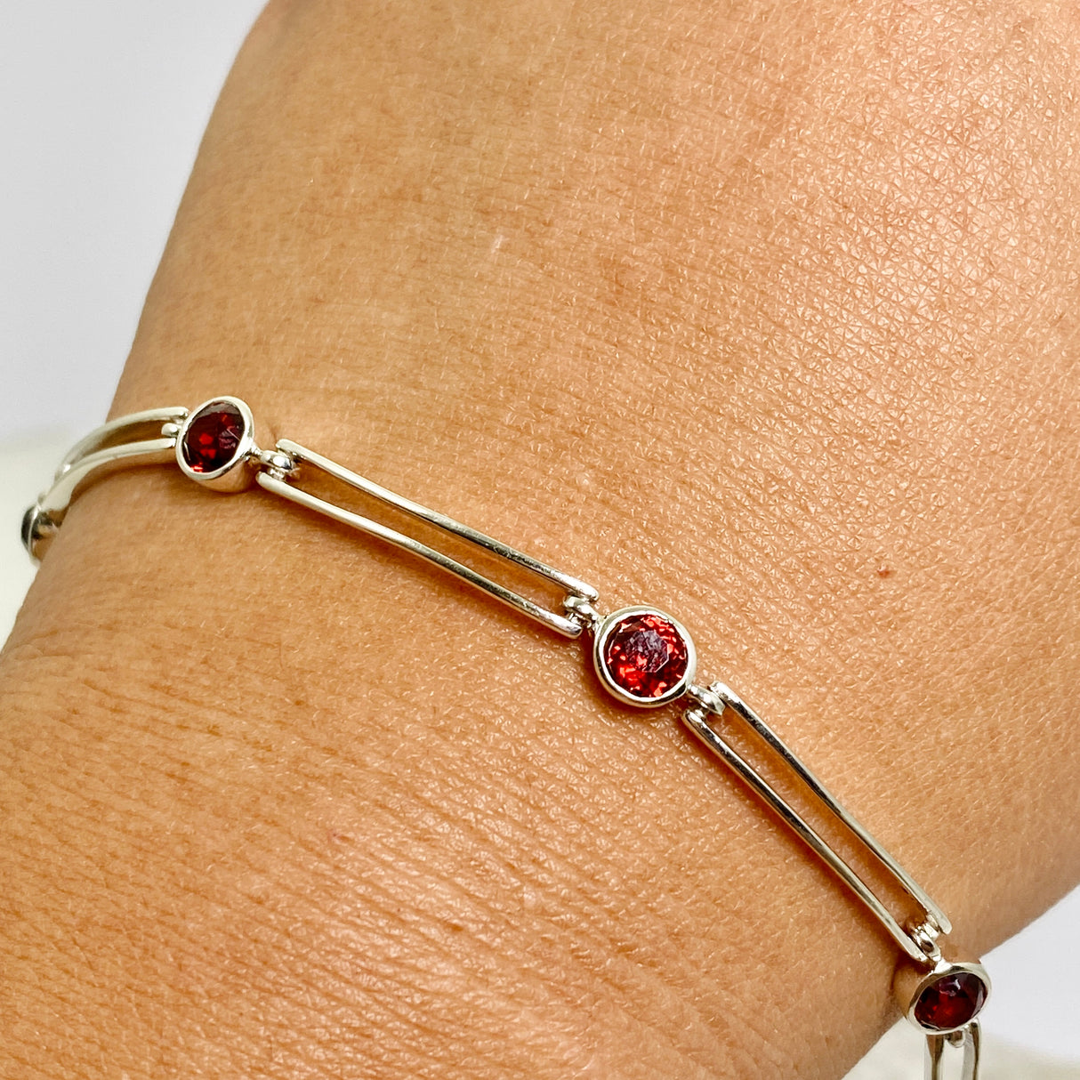 Garnet round faceted gemstones with silver split spacer design