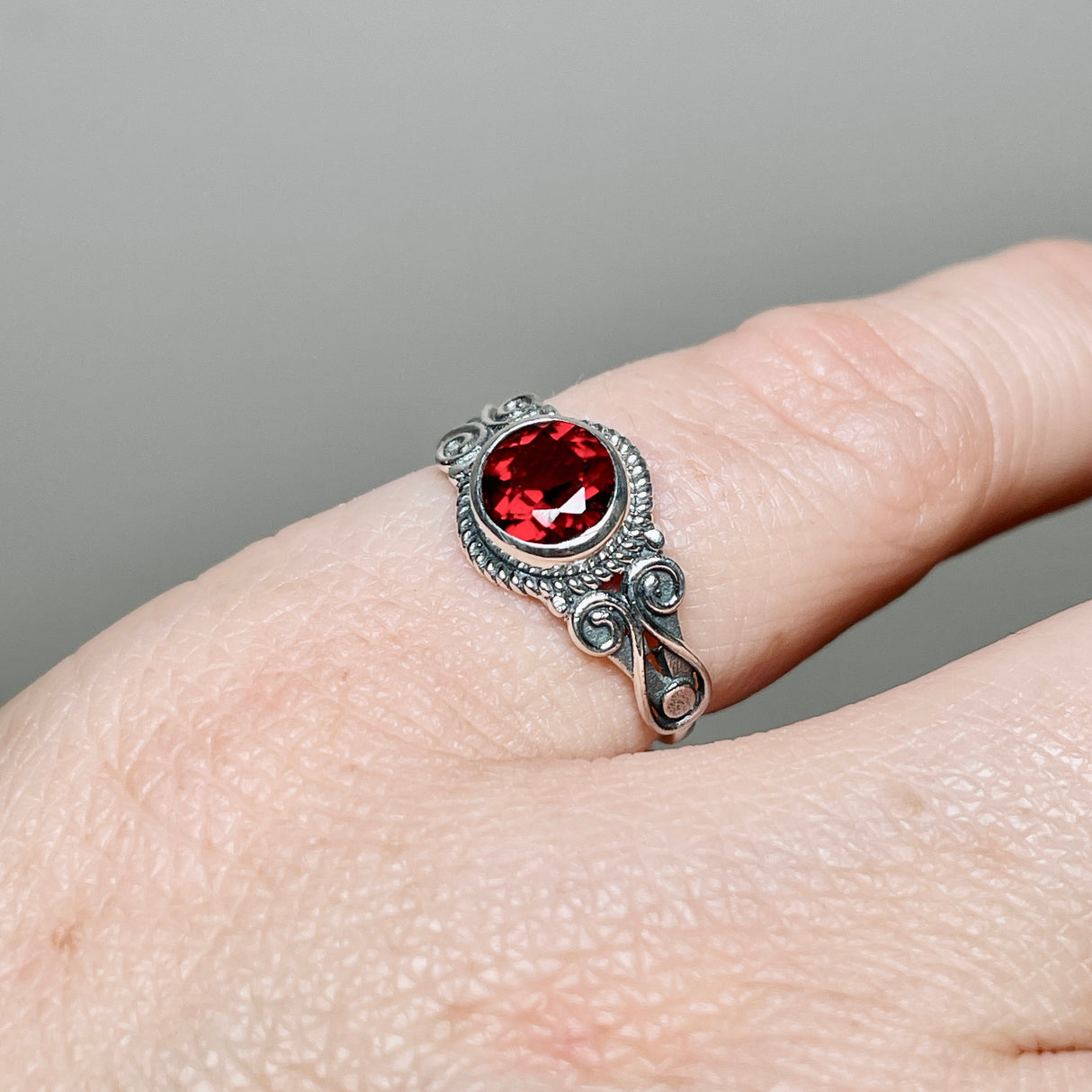 Garnet Round Faceted Ring in a Decorative Setting R4170