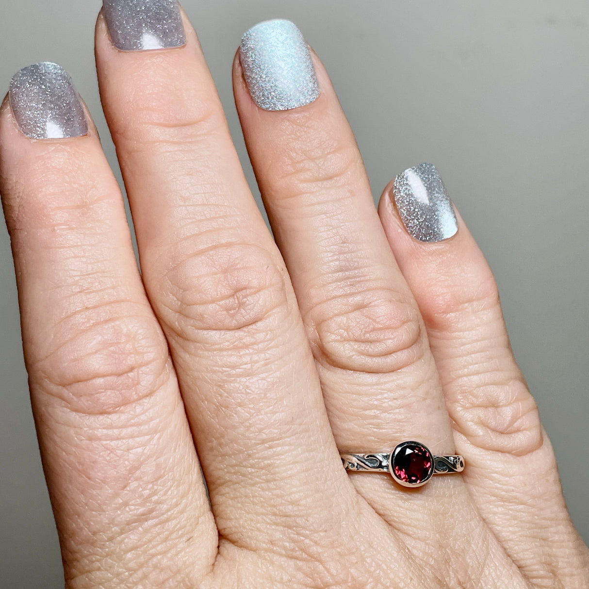 Garnet Round Faceted Ring in a Decorative Setting R4807