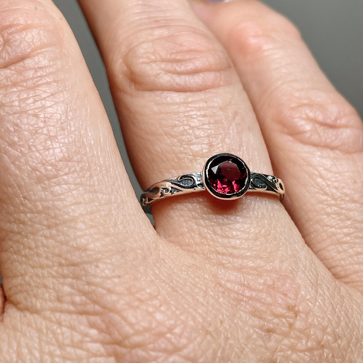 Garnet Round Faceted Ring in a Decorative Setting R4807