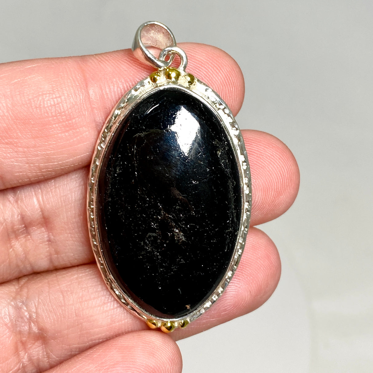 Black Tourmaline Oval Cabochon Pendant in a Decorative Setting KPGJ4594