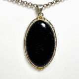 Black Tourmaline Oval Cabochon Pendant in a Decorative Setting KPGJ4594