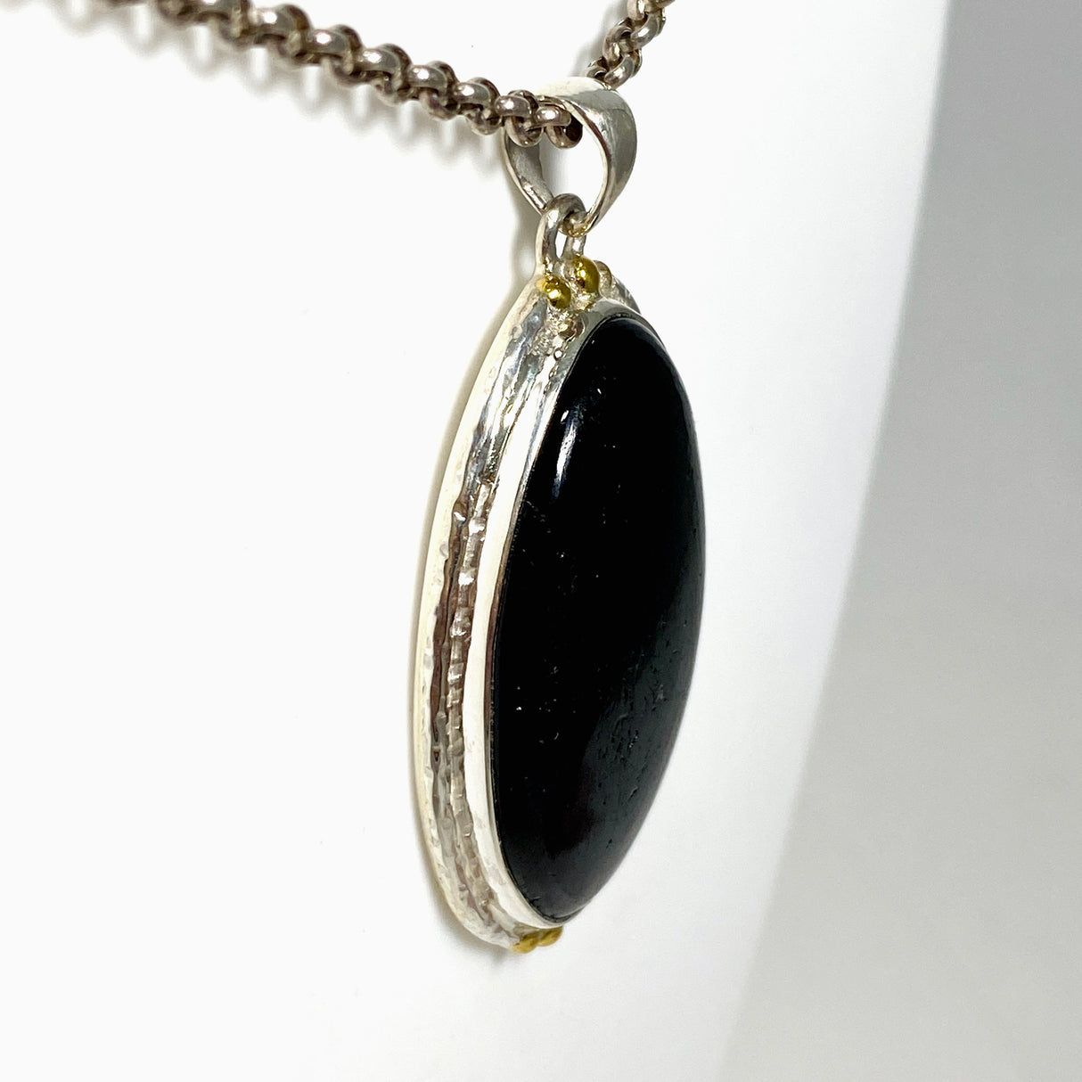 Black Tourmaline Oval Cabochon Pendant in a Decorative Setting KPGJ4594