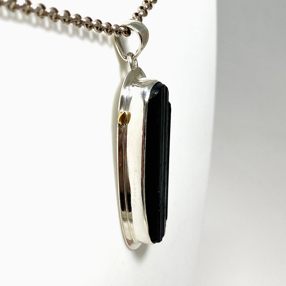 Black Tourmaline Oval Raw Pendant in a Decorative Setting KPGJ4595