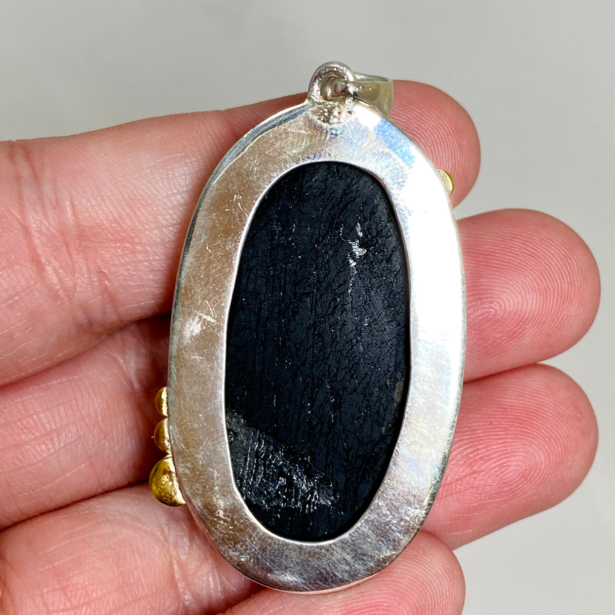 Black Tourmaline Oval Raw Pendant in a Decorative Setting KPGJ4596