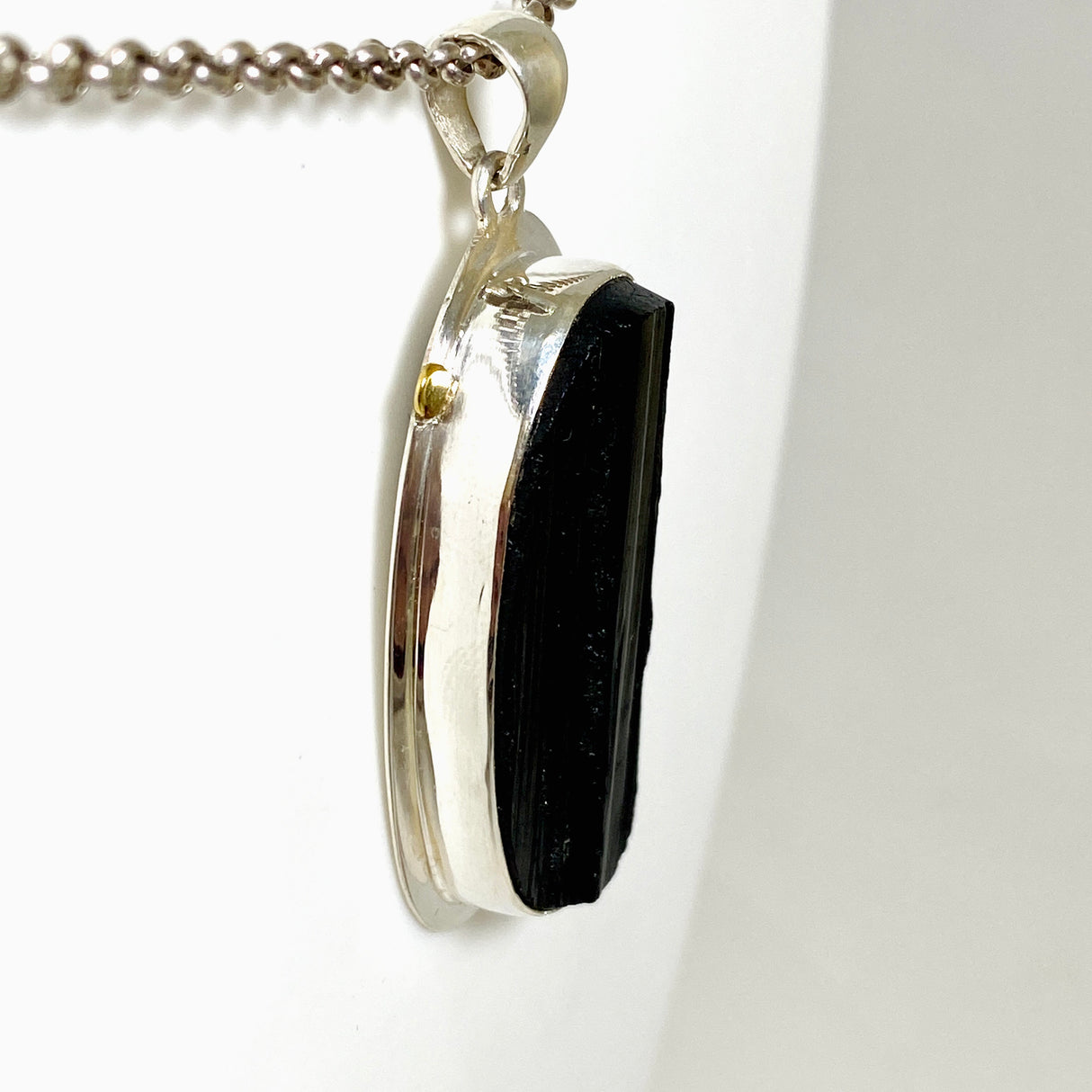 Black Tourmaline Oval Raw Pendant in a Decorative Setting KPGJ4596