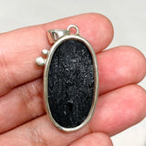 Black Tourmaline Oval Raw Pendant in a Decorative Setting KPGJ4597