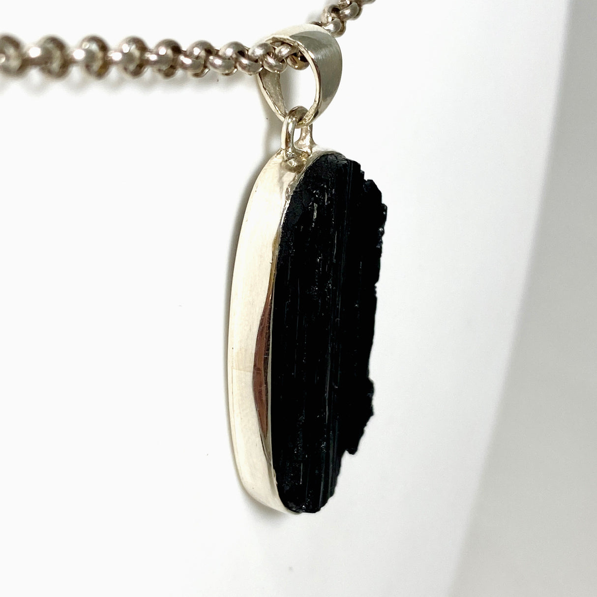 Black Tourmaline Oval Raw Pendant in a Decorative Setting KPGJ4597