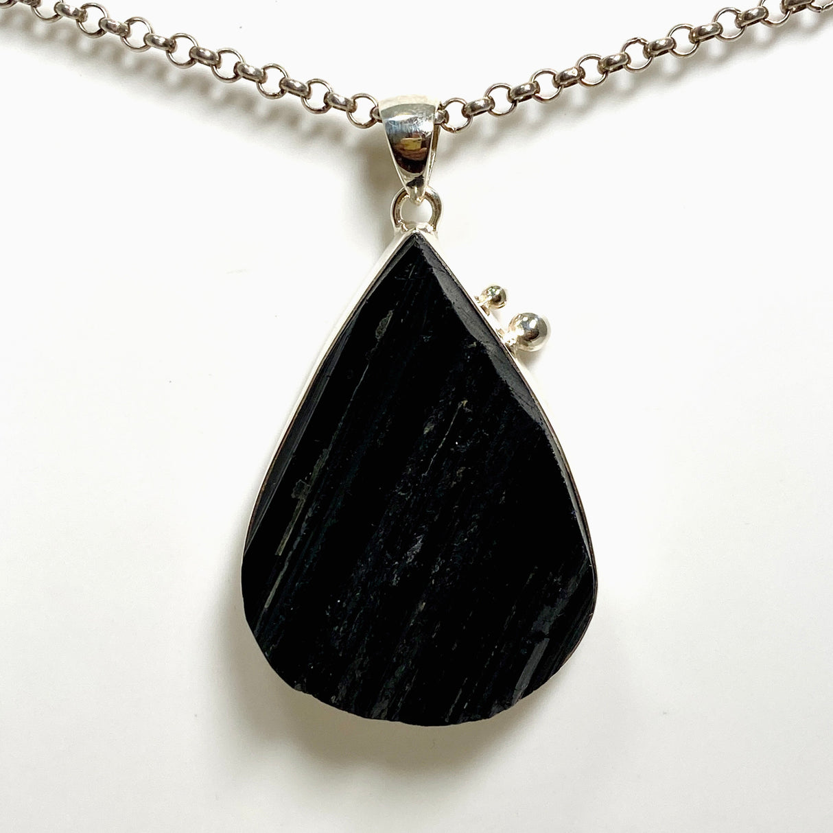 Black Tourmaline Teardrop Raw Pendant in a Decorative Setting KPGJ4599