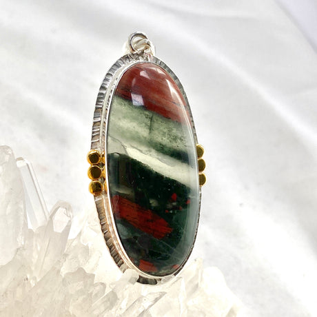 Bloodstone Oval Cabochon Pendant in a Decorative Setting with Brass Accents KPGJ4745