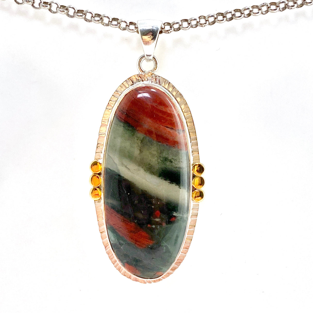 Bloodstone Oval Cabochon Pendant in a Decorative Setting with Brass Accents KPGJ4745