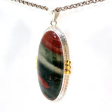 Bloodstone Oval Cabochon Pendant in a Decorative Setting with Brass Accents KPGJ4745