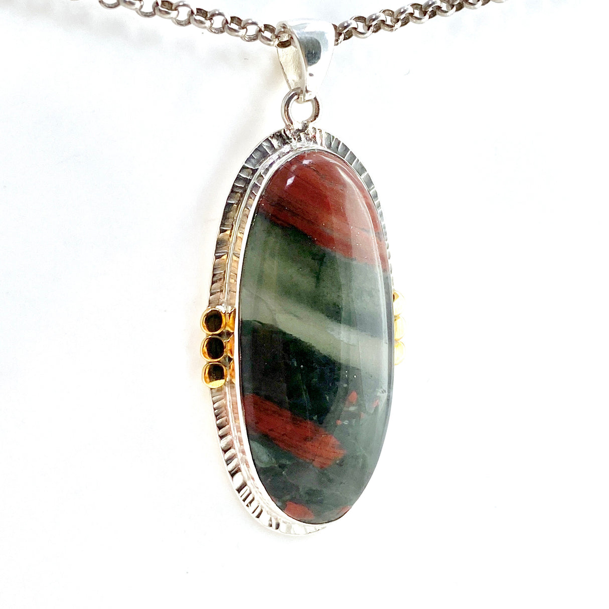 Bloodstone Oval Cabochon Pendant in a Decorative Setting with Brass Accents KPGJ4745