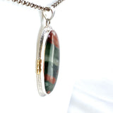 Bloodstone Oval Cabochon Pendant in a Decorative Setting with Brass Accents KPGJ4745