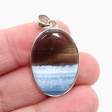 Blue Owhyee Opal Oval Cabochon Pendant in a Hammered Setting KPGJ4651