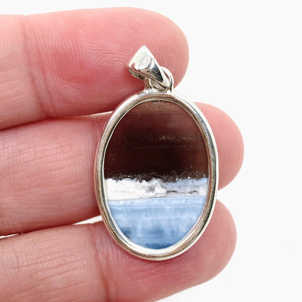 Blue Owhyee Opal Oval Cabochon Pendant in a Hammered Setting KPGJ4651