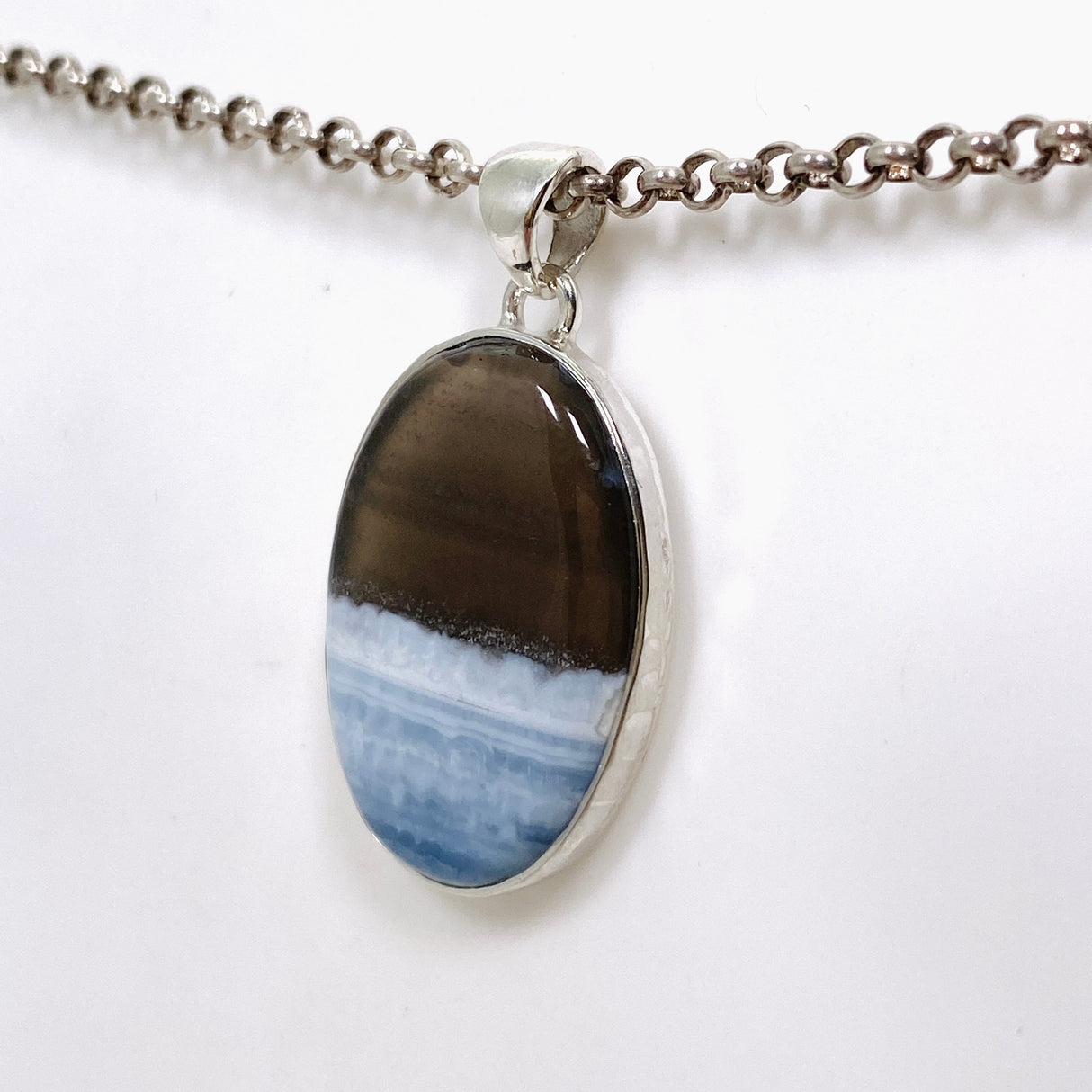 Blue Owhyee Opal Oval Cabochon Pendant in a Hammered Setting KPGJ4651