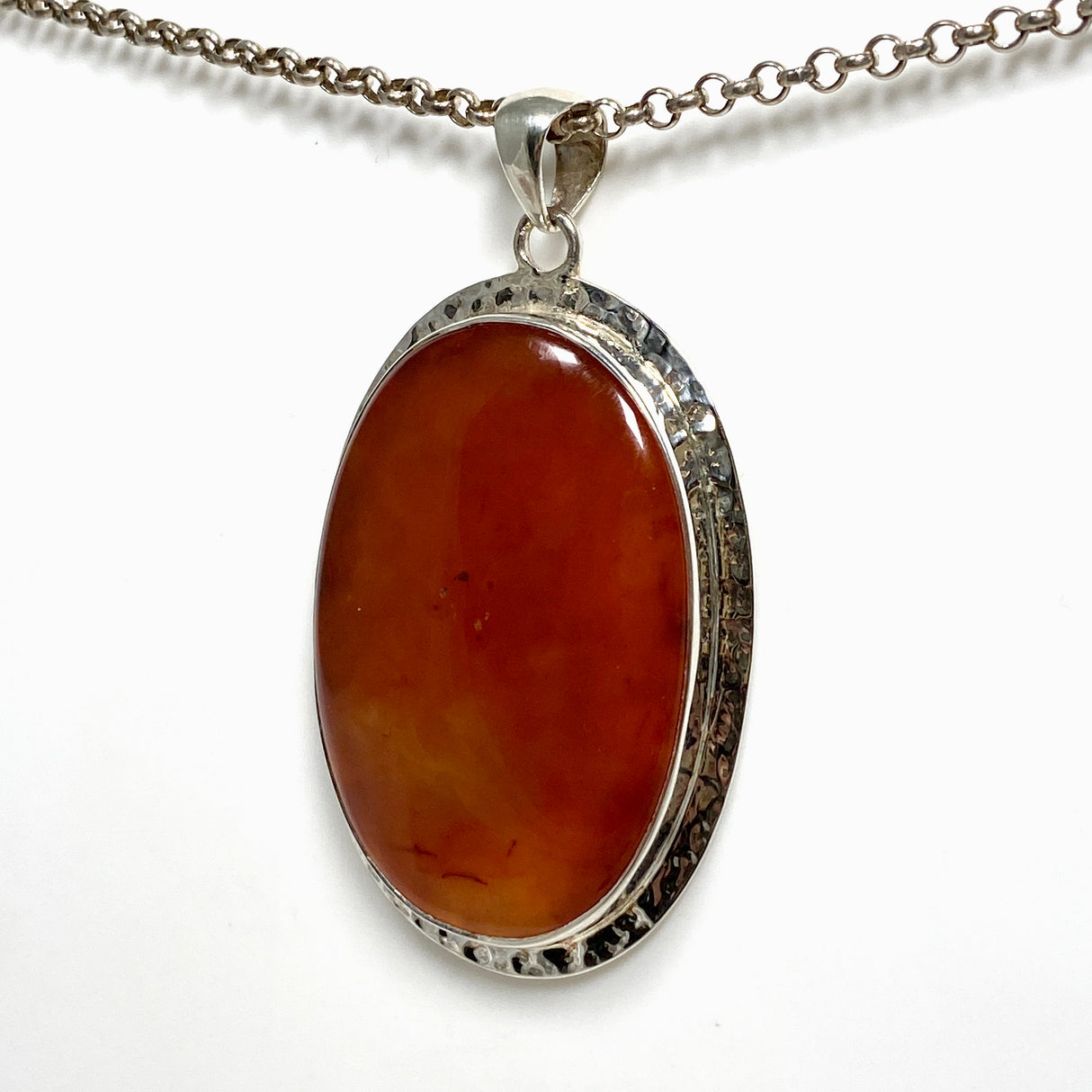 Carnelian Oval pendant in a decorative hammered setting KPGJ4579