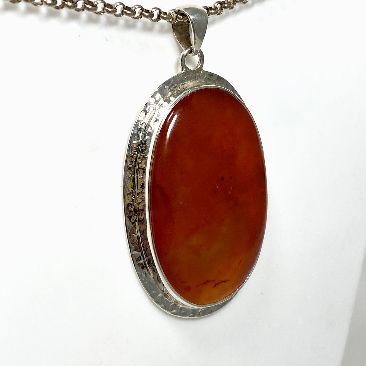 Carnelian Oval pendant in a decorative hammered setting KPGJ4579