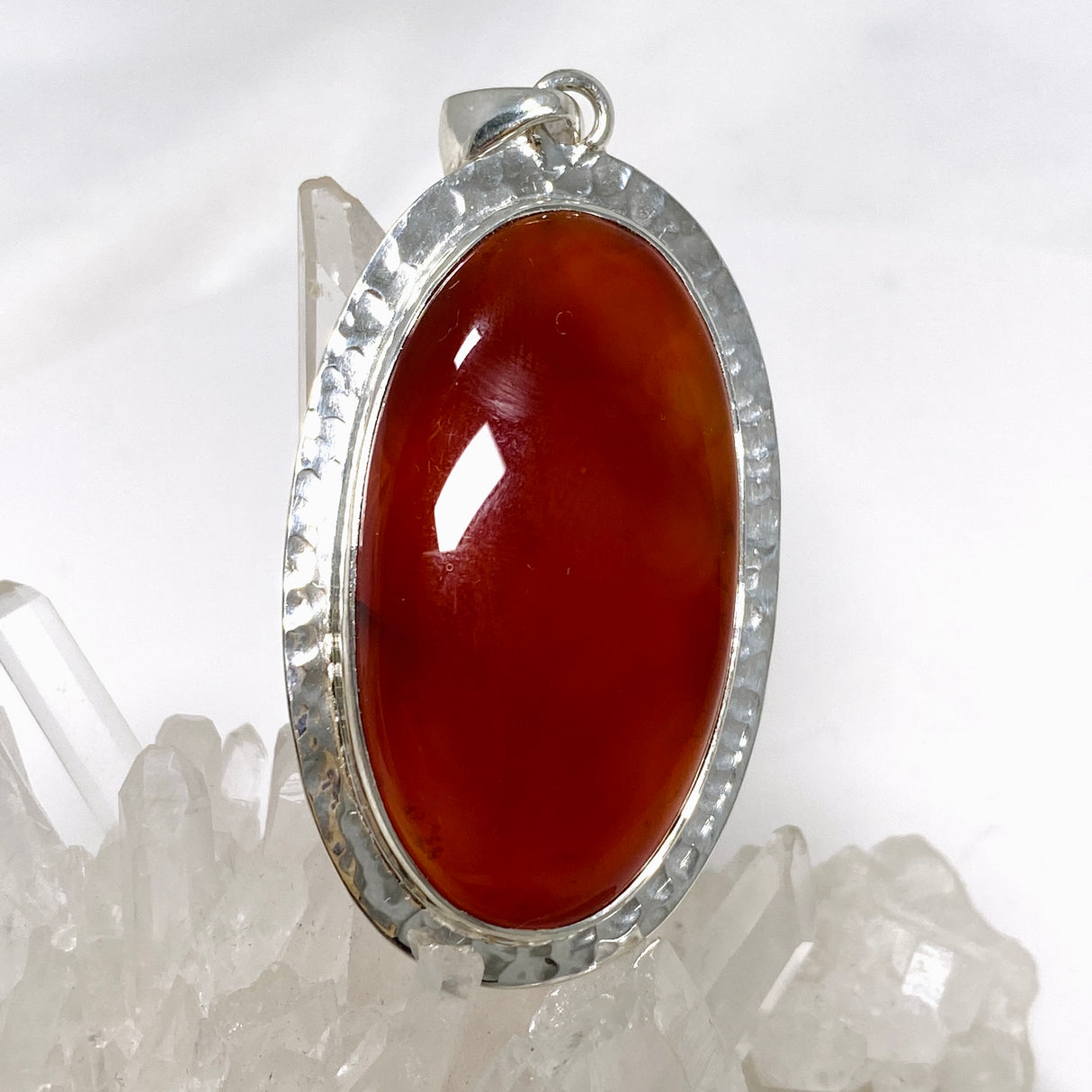 Carnelian Oval pendant in a decorative hammered setting KPGJ4580