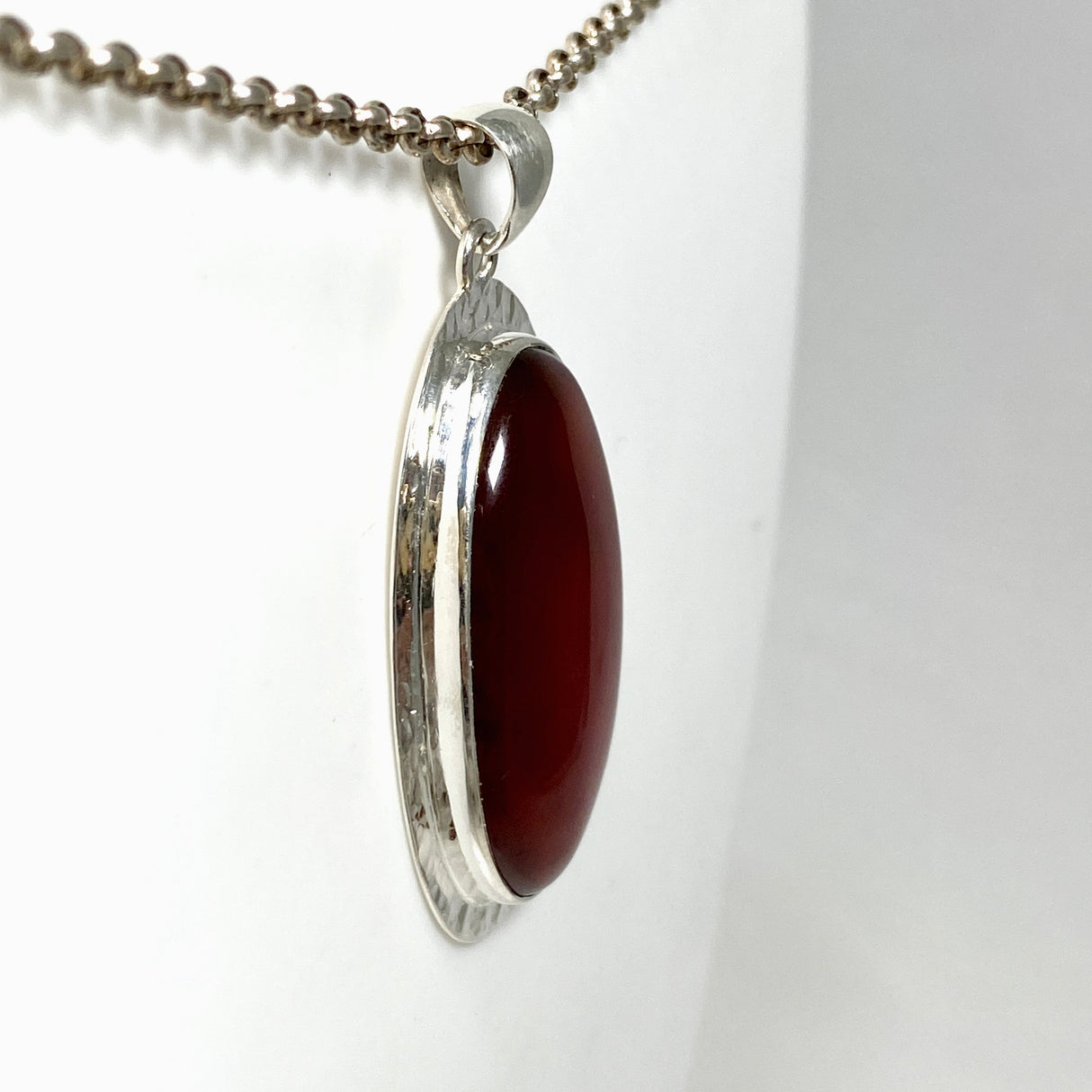 Carnelian Oval pendant in a decorative hammered setting KPGJ4580