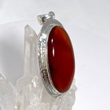 Carnelian Oval pendant in a decorative hammered setting KPGJ4580