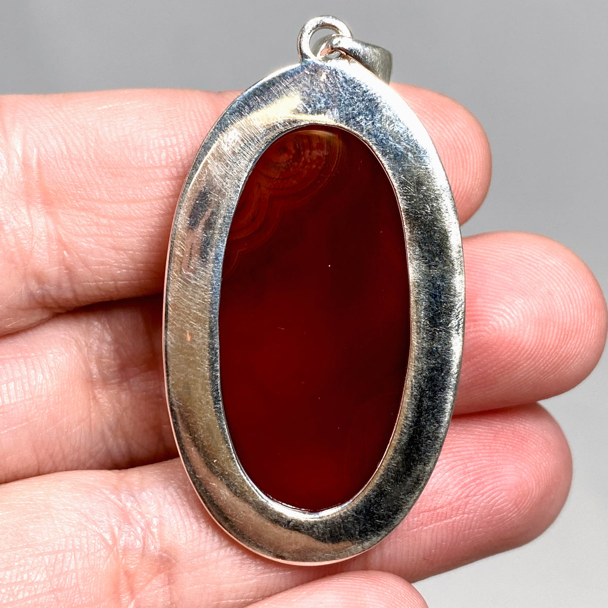 Carnelian Oval pendant in a decorative hammered setting KPGJ4580