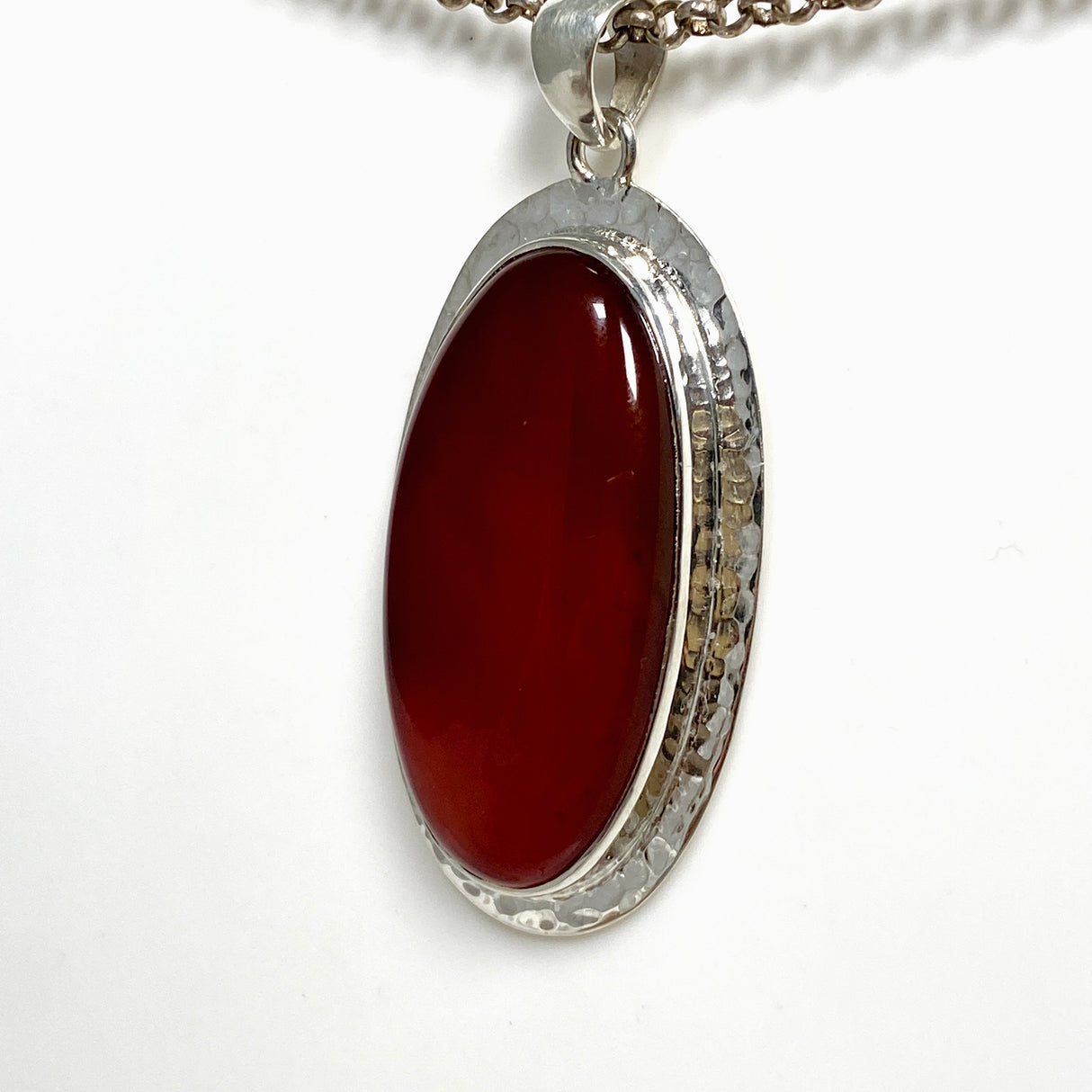 Carnelian Oval pendant in a decorative hammered setting KPGJ4580